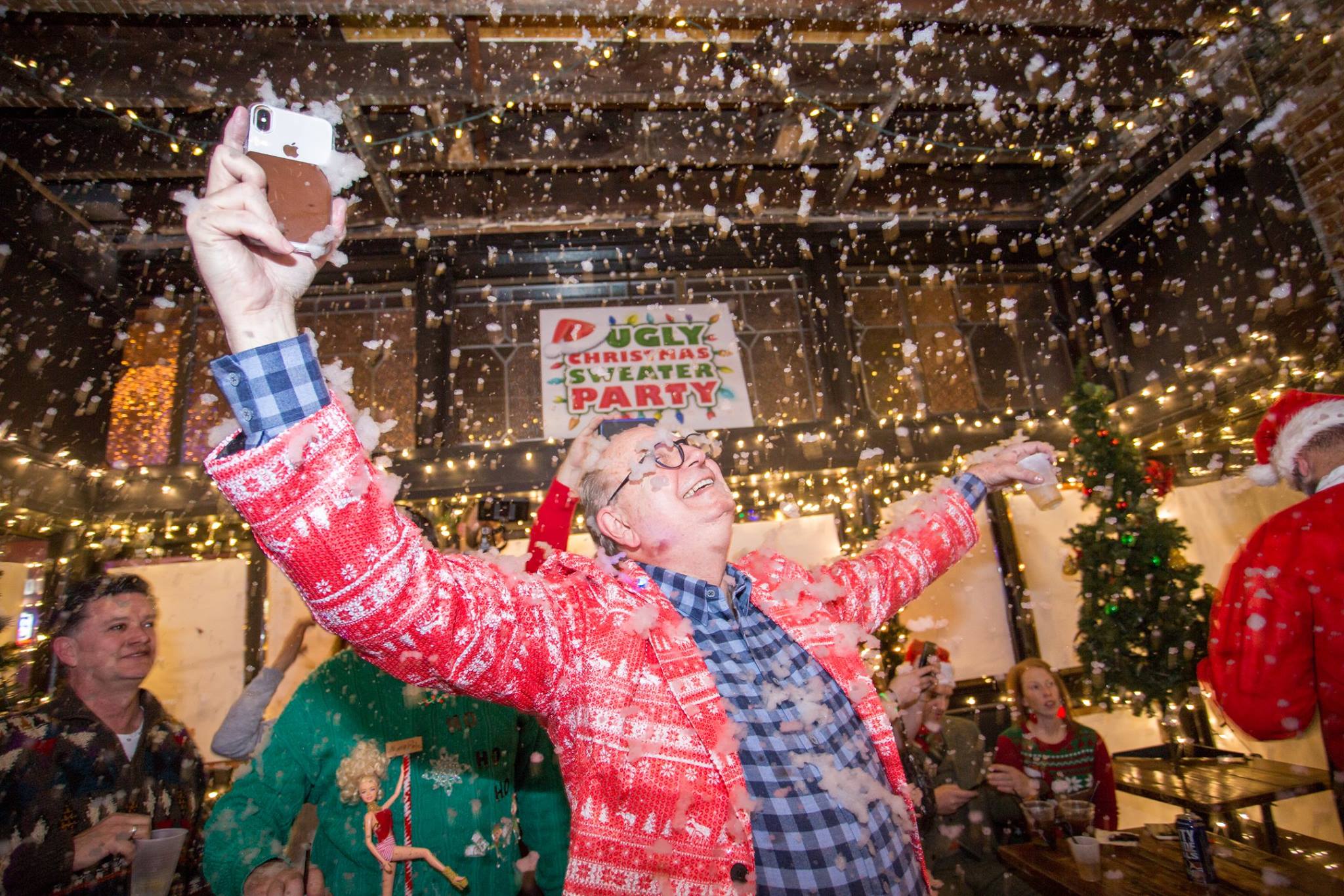 An indoor snowstorm at The Ugly Christmas Sweater Party